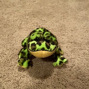 Green and black specked stuffed frog